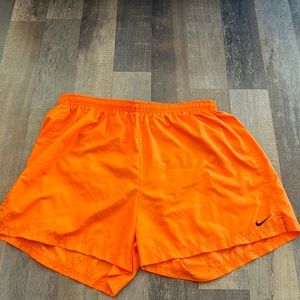 Women’s bright orange Nike shorts
